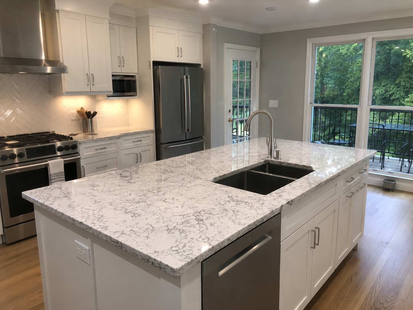 Granite countertops in Ohio with a polished white stone kitchen island installation